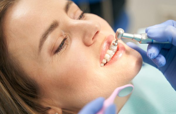Professional teeth cleaning removes plaque, tartar, and bacteria for a healthy smile